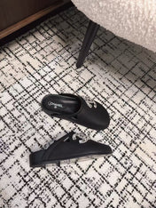 FLAT MULES IN BLACK CALFSKIN
