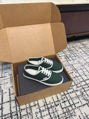 PRADA 26S LACE UP SNEAKERS IN DARK TEAL CANVAS