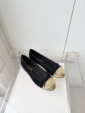 CHANEL 26S BALLET FLATS IN BLACK SUEDE WITH GOLD TOE CAP AND BOW