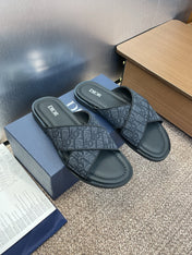 DIOR 25S ALIAS CROSS-STRAP SLIDES IN BLACK CALFSKIN WITH CD OBLIQUE DARK BLUE LOGO