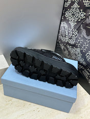 PRADA 26S MULE LOAFERS IN BLACK MESH AND CALFSKIN