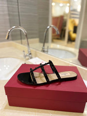 VALENTINO 26S ROCKSTUD CAGED SANDALS IN BLACK PATENT CALFSKIN
