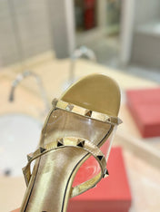 ROCKSTUD MULE SANDALS IN GOLD CALFSKIN AND TRANSPARENT PVC FILM