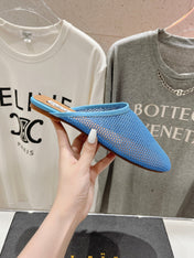 ALAIA FLAT MULES IN CERULEAN BLUE MESH FISHNET