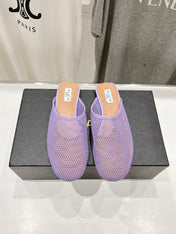 ALAIA FLAT MULES IN LIGHT PURPLE MESH FISHNET