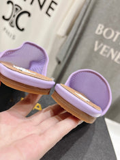 ALAIA FLAT MULES IN LIGHT PURPLE MESH FISHNET