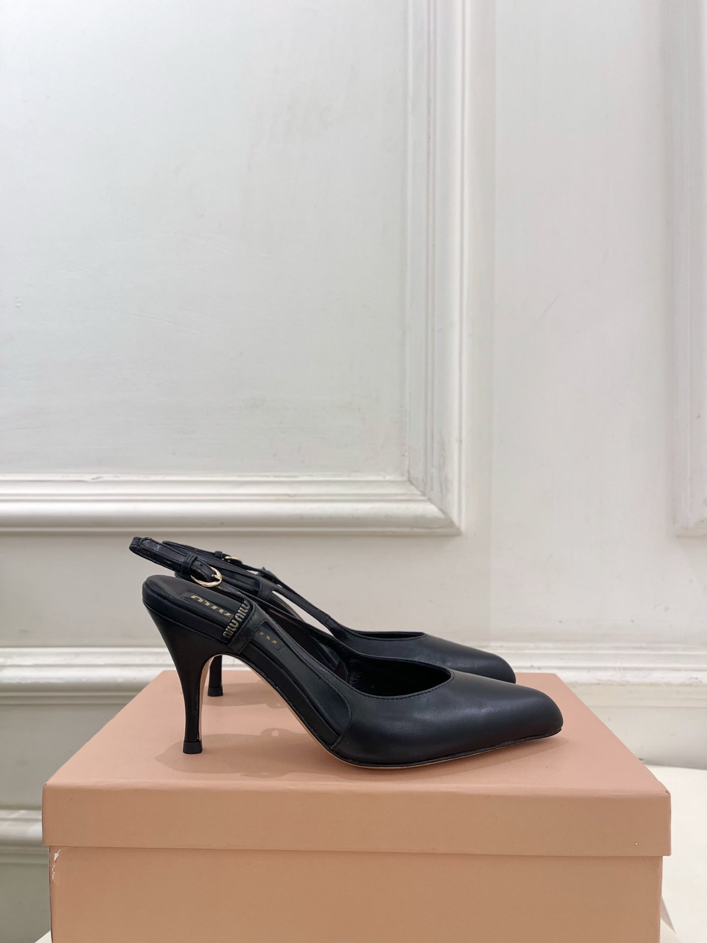 MIUMIU 26S SLINGBACK PUMPS 85MM IN BLACK CALFSKIN