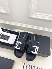 CHANEL 26S FLAT SLIDES IN BLACK LAMBSKIN WITH WHITE CC LOGO