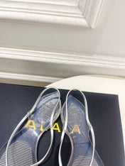 ALAIA 26S POINTED-TOE THONG SANDALS IN SILVER AND TRANSPARENT PVC