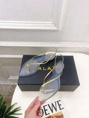 ALAIA 26S POINTED-TOE THONG SANDALS IN GOLD AND TRANSPARENT PVC
