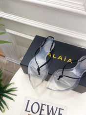 ALAIA 26S POINTED-TOE THONG SANDALS IN BLACK SATIN AND TRANSPARENT PVC