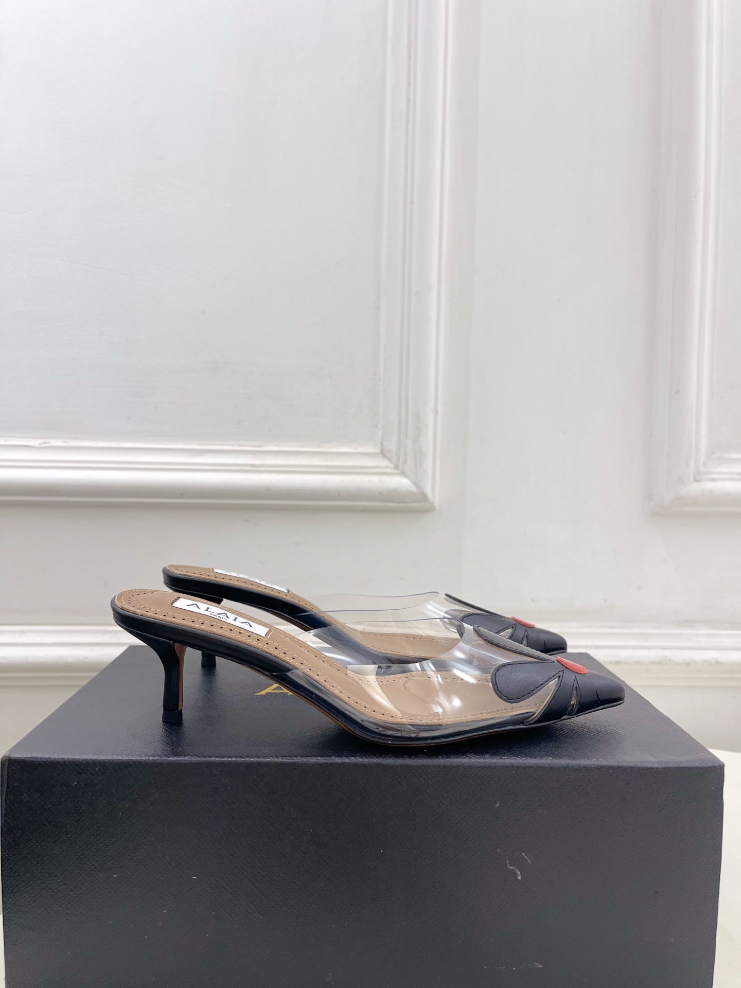 ALAIA 26S MULE HEELS 55 MM IN BLACK LAMBSKIN AND TRANSPARENT PVC